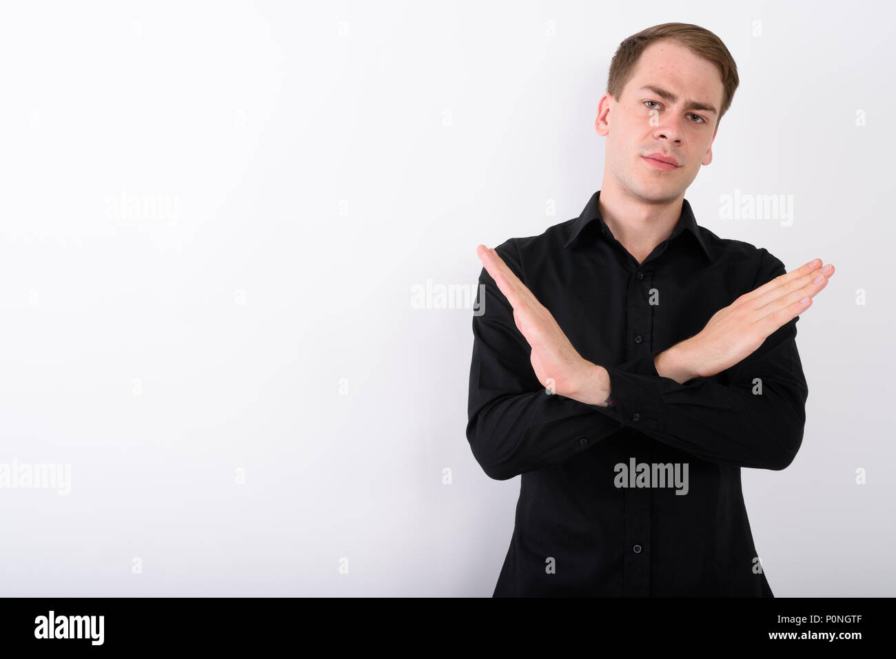 Junge gut aussehender Geschäftsmann vor weißem Hintergrund Stockfoto