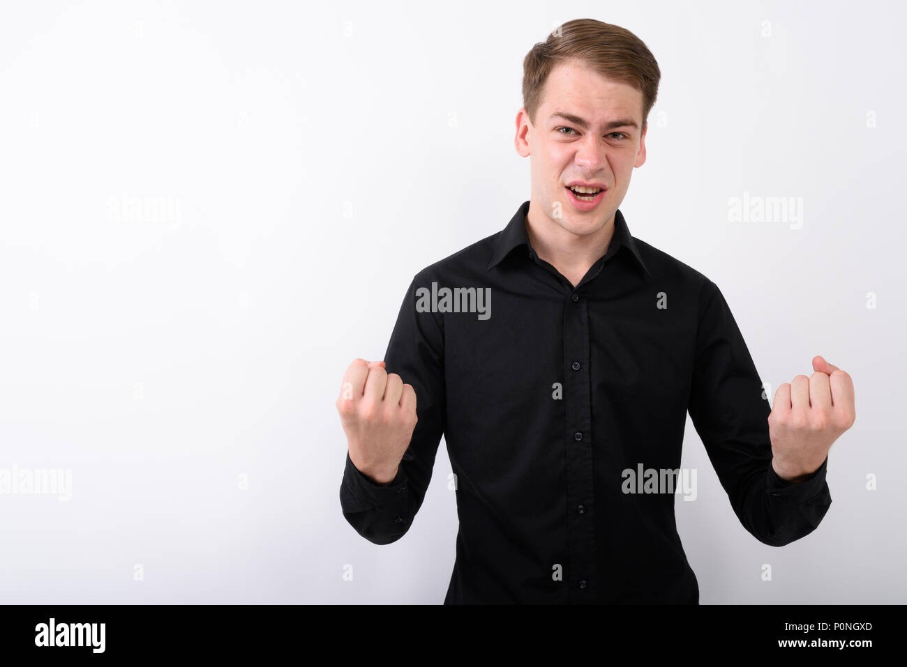 Junge gut aussehender Geschäftsmann vor weißem Hintergrund Stockfoto