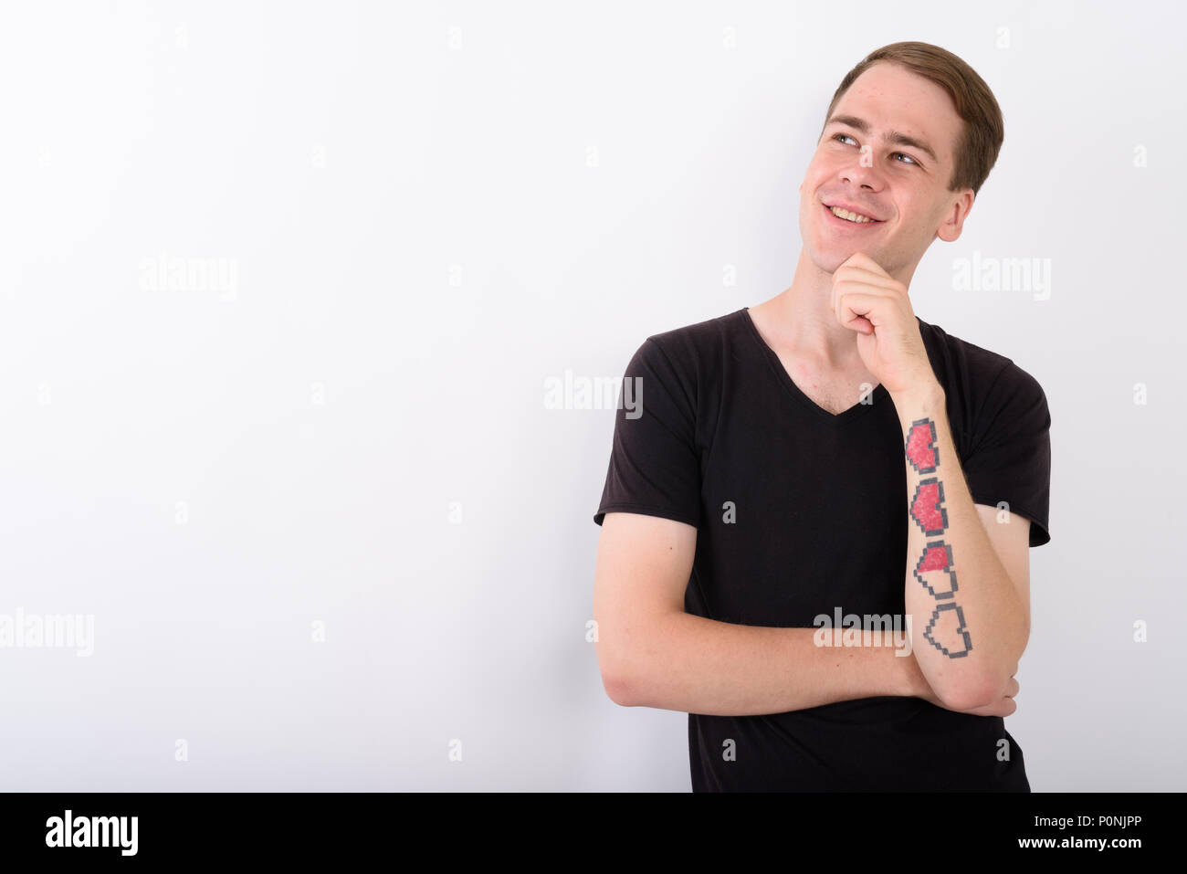 Jungen gutaussehenden Mann gegen den weißen Hintergrund Stockfoto