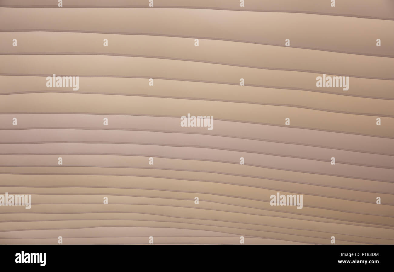 Sanddünen, Form und Farbe, Textur Hintergrund. Beige textil Dach für Sonnenschutz, wellenförmige Muster Stockfoto