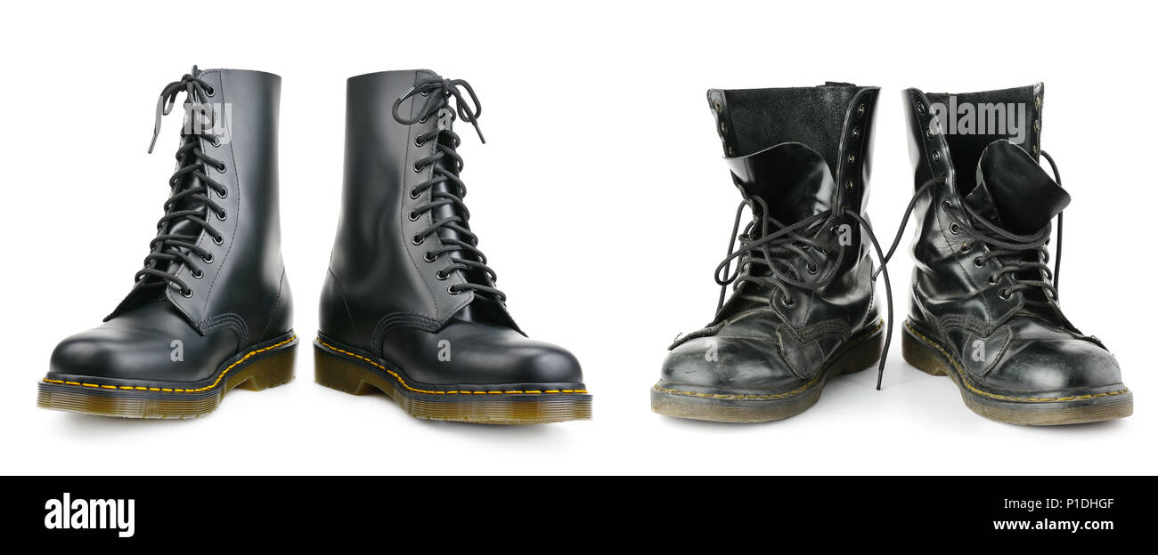 Ein und dasselbe Paar der schwarzen Männer Stiefel. Neue und abgenutzt. Auf weissem Hintergrund. Stockfoto