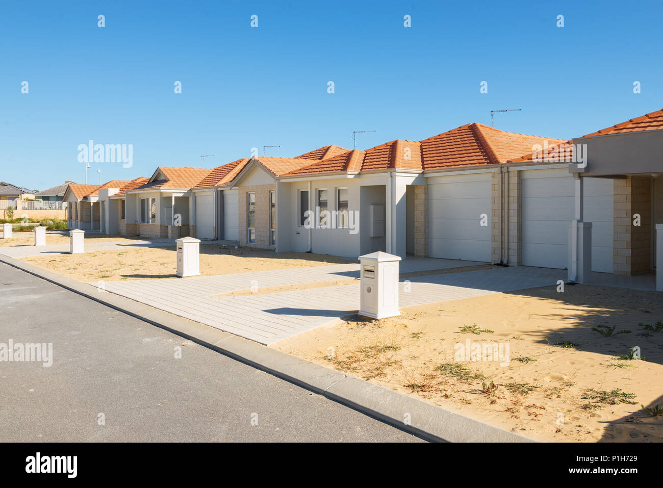 neue s Häuser im Bau befindliche Zeile Stockfoto