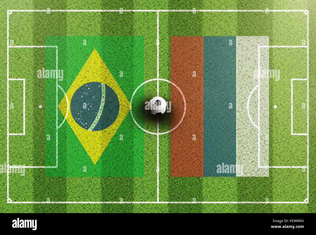 Blick von oben auf die grünen Fußballplatz mit Fahnen von Brasilien und Serbien Stockfoto