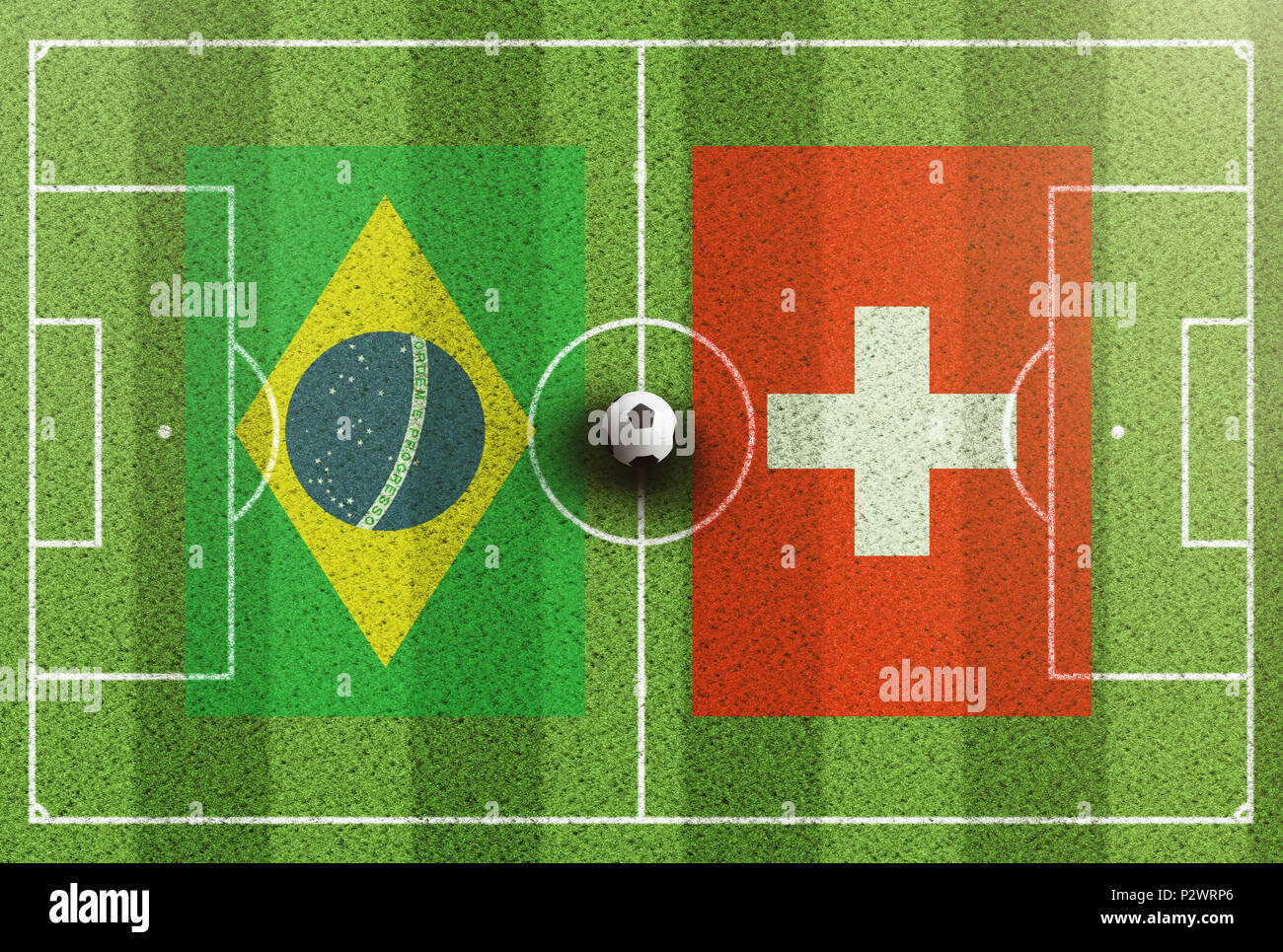 Blick von oben auf die grünen Fußballplatz mit Fahnen von Brasilien und in der Schweiz Stockfoto