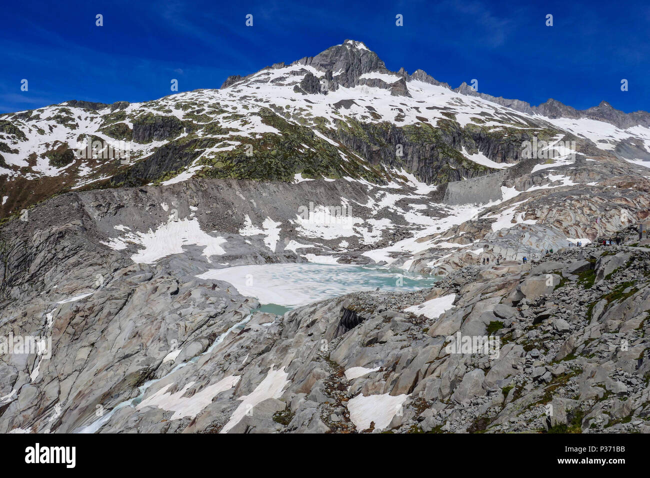 See am Ende der Rhonegletscher, Furka, Rhonegletscher, Rhonegletsch, Frühling, Schweizer, Schweiz, Stockfoto