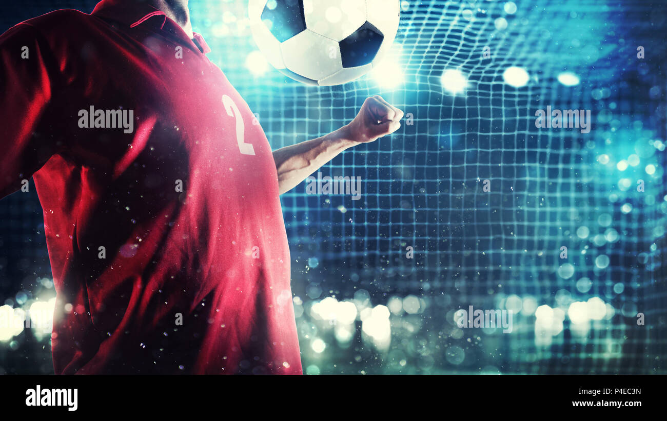 Stürmer Spieler steuert den Ball in der Nähe des Fußball-Ziel Stockfoto