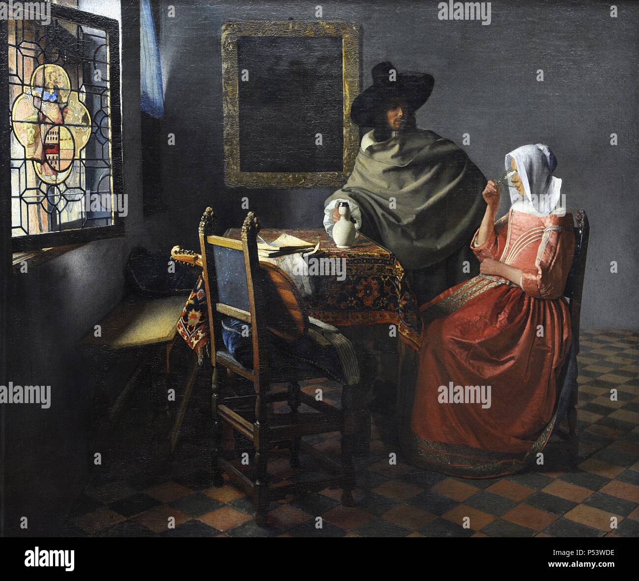 Johannes Vermeer (1632-1675). Holländische Maler spezialisiert auf inländische Innenraum Szenen der mittleren Klasse leben. Der Wein Glas, C. 1658-1660. Auch als das Glas Wein oder die Dame und den Herrn trinken Wein bekannt. Öl auf Leinwand. Gemaldegalerie. Berlin. Deutschland. Stockfoto