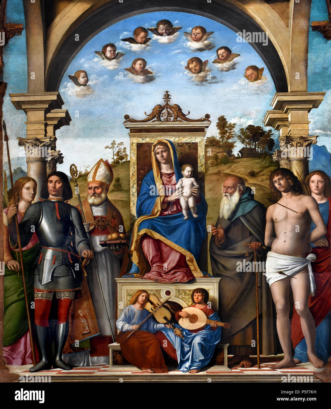 Madonna mit Kind und Heiligen Caterina, Giorgio, Nicola, Antonio Abt, Sebastiano und Lucia (Pala Dragan) von GIAMBATTISTA Cima da Conegliano 1459 - 1517 Italien, Italienisch thront. Stockfoto