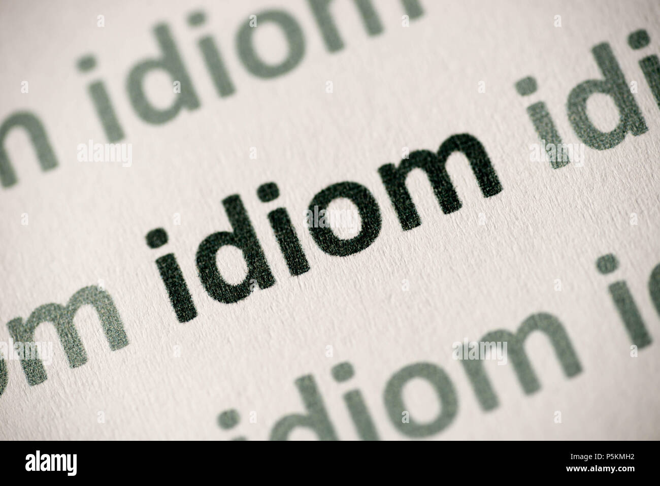 Wort Idiom auf weißem Papier Makro gedruckt Stockfoto