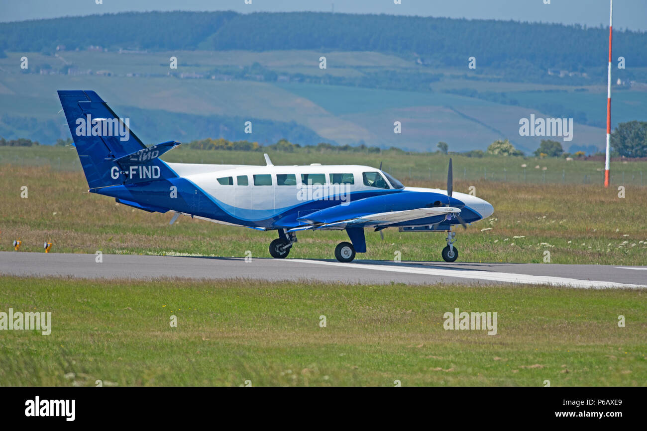 Eine Cessna 406 von Atlantic Airlines Ltd Anfahren/Landung auf dem Inverness Dalcross Flughafen im Norden von Schottland. Stockfoto