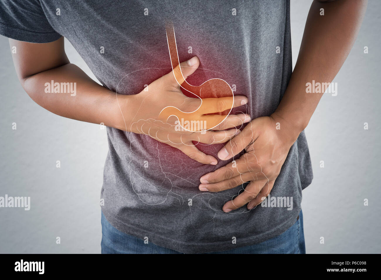 Acid Reflux oder Sodbrennen, das Foto des Magens und der inneren Organe des Körpers gegen grauen Hintergrund, Magenschmerzen, schlechte Gesundheit, männliche Anatom Stockfoto