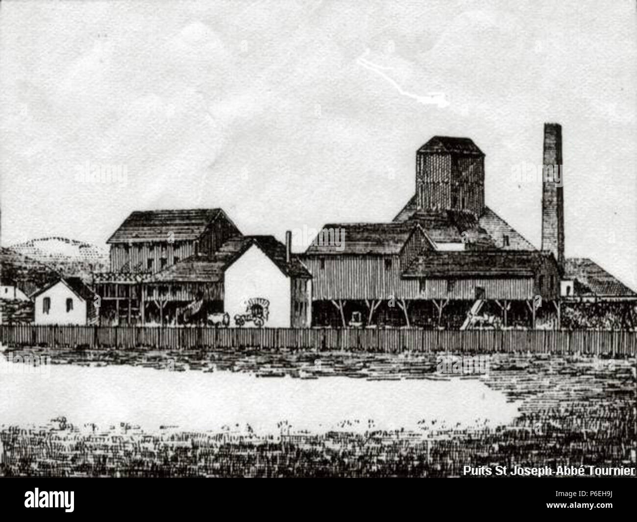 Français: Les Ateliers du Puits Saint-Joseph; derrière Le chevalement et la Cheminée. 1880 S1 1880-Puits Saint-Joseph-Tiefdruck Stockfoto