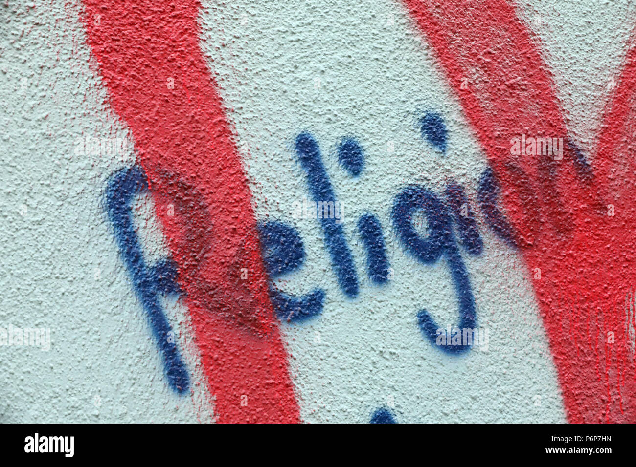 Graffiti an der Wand. Religion. Basel. Die Schweiz. Stockfoto