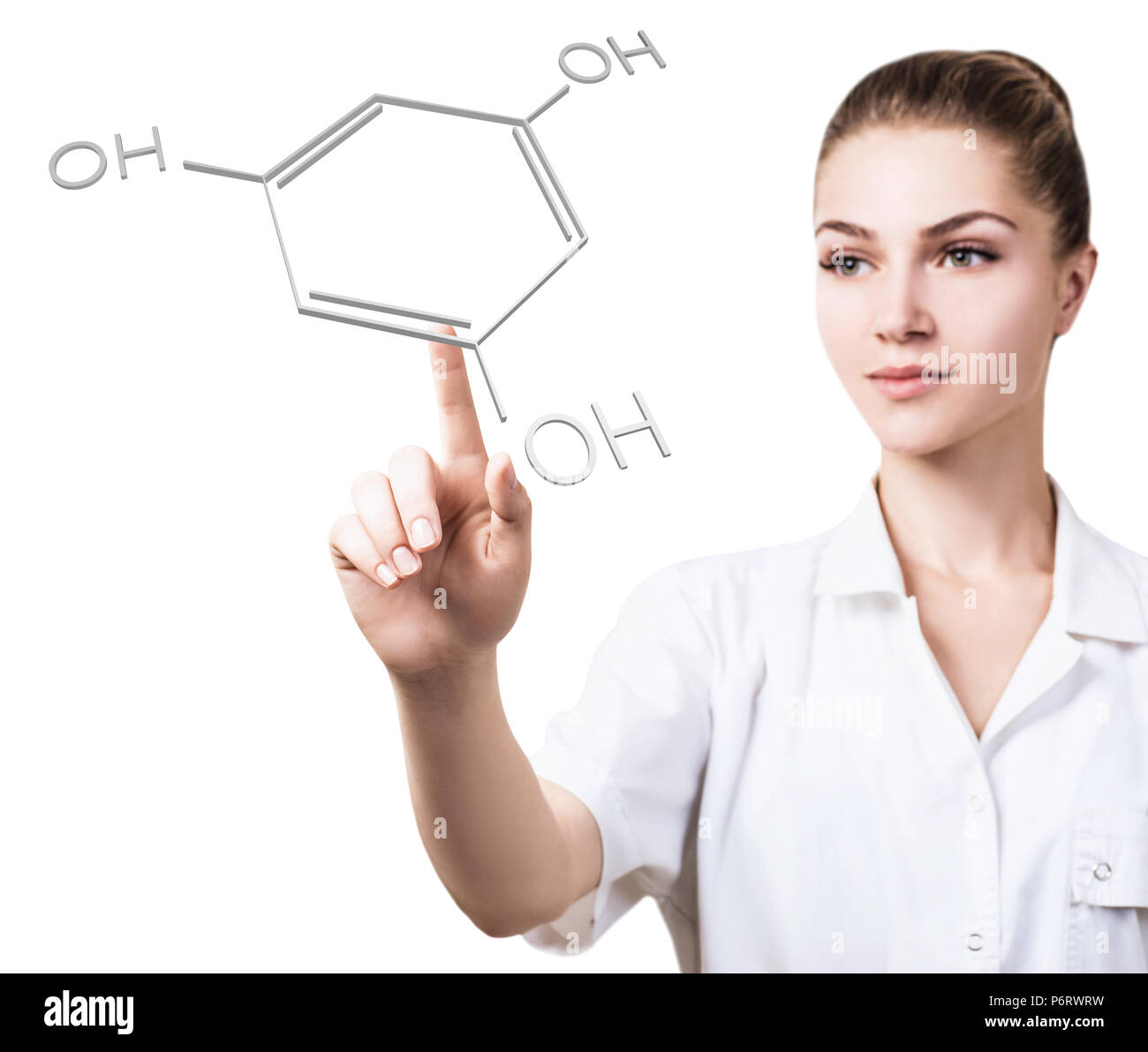 Junge weibliche Arzt verweist auf chemische Formel. Stockfoto