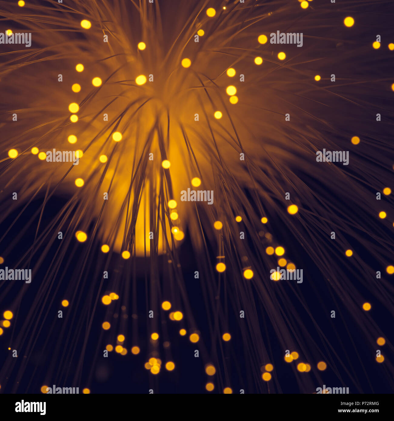Glänzend orange Fiber Optics Hintergrund Stockfoto