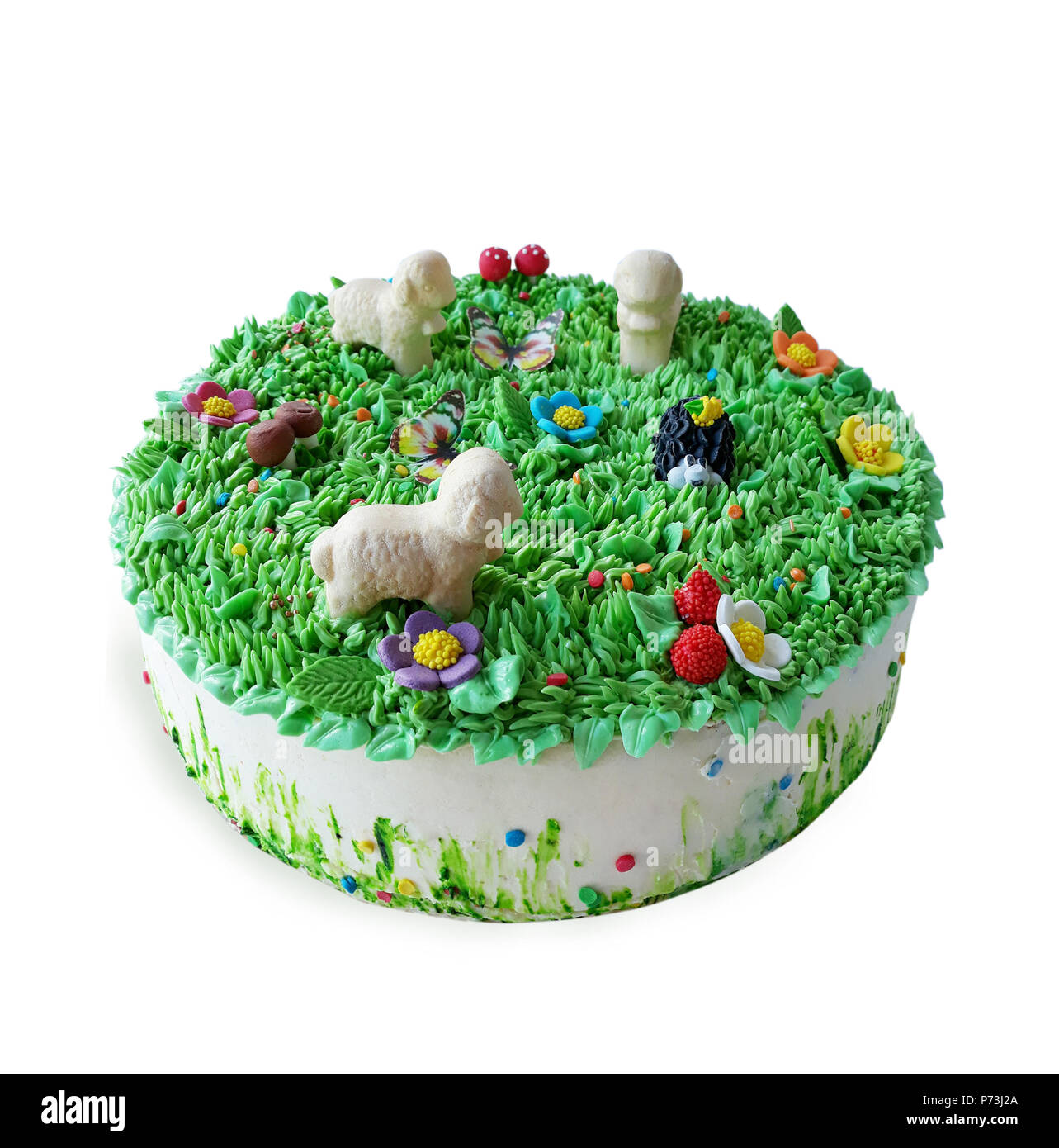 Kuchen mit Lämmer auf Gras, die aus Rahm Stockfoto