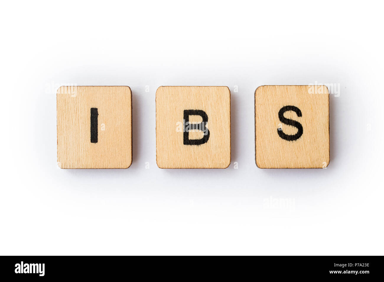 Die Abkürzung IBS - Reizdarm, Dinkel mit hölzernen Buchstabensteine. Stockfoto