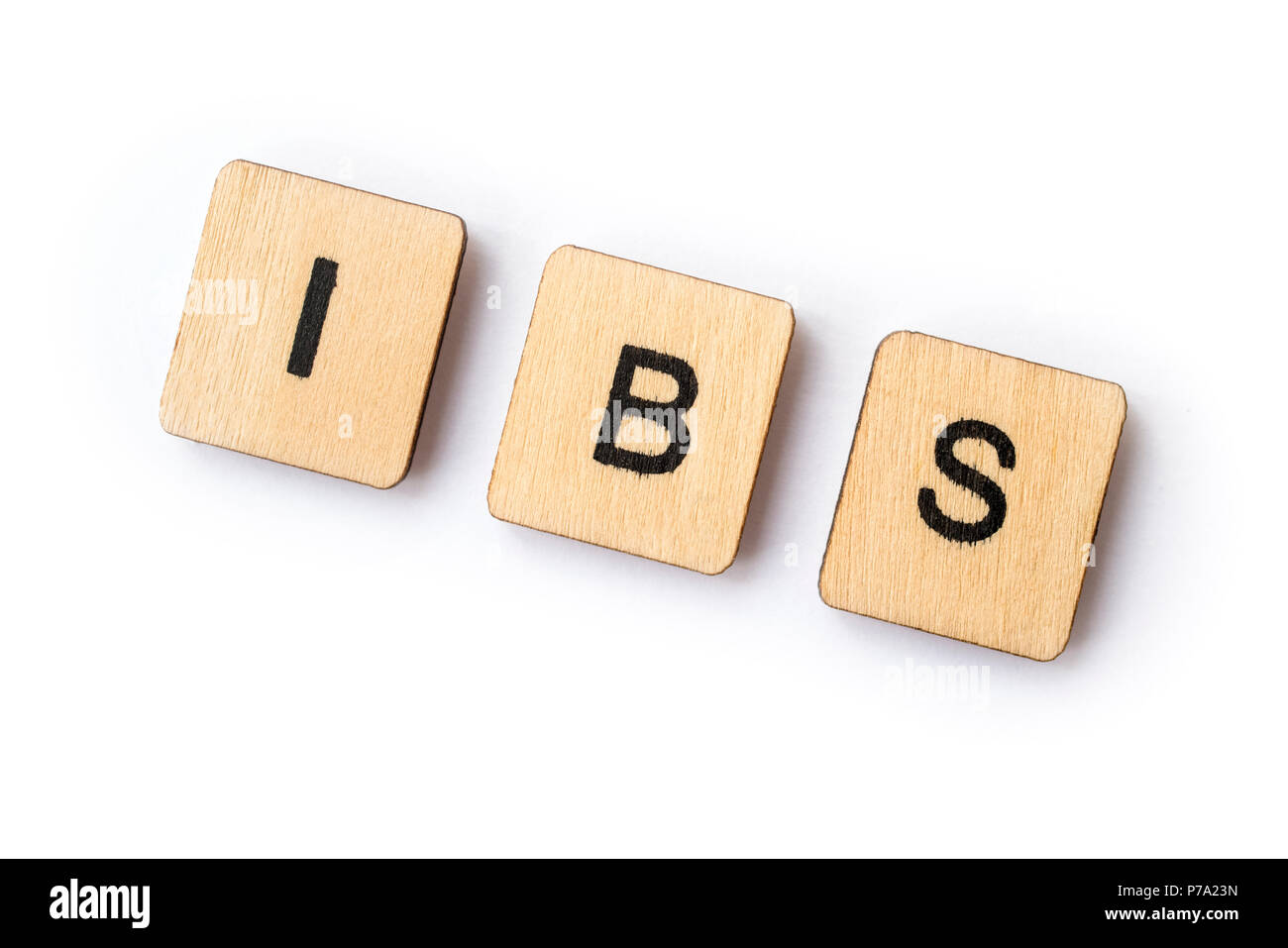 Die Abkürzung IBS - Reizdarm, Dinkel mit hölzernen Buchstabensteine. Stockfoto