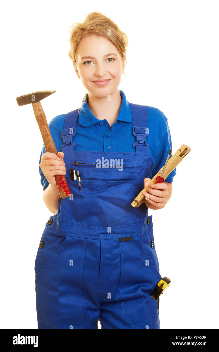 Junge Frau als Handwerker oder Heimwerker in Blue Man mit Werkzeug Stockfoto
