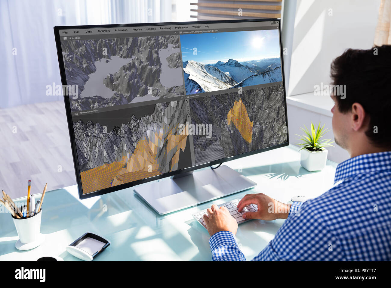 Kreative Designer bearbeiten 3D-llndscape in Software auf den Computer im Büro Stockfoto