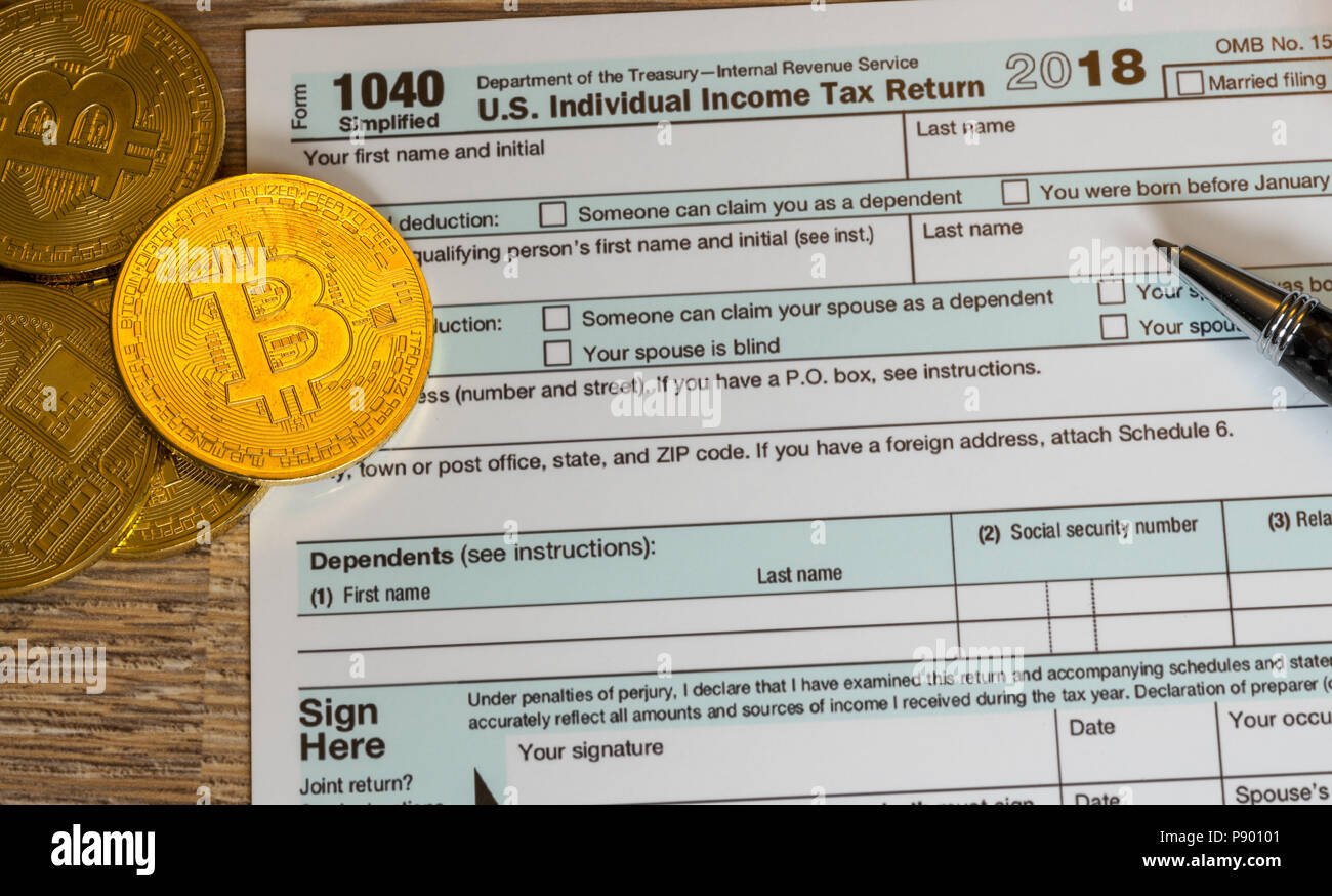 Form1040 mit bitcoin Münzen für Reporting Währungsgewinne vereinfacht Stockfoto