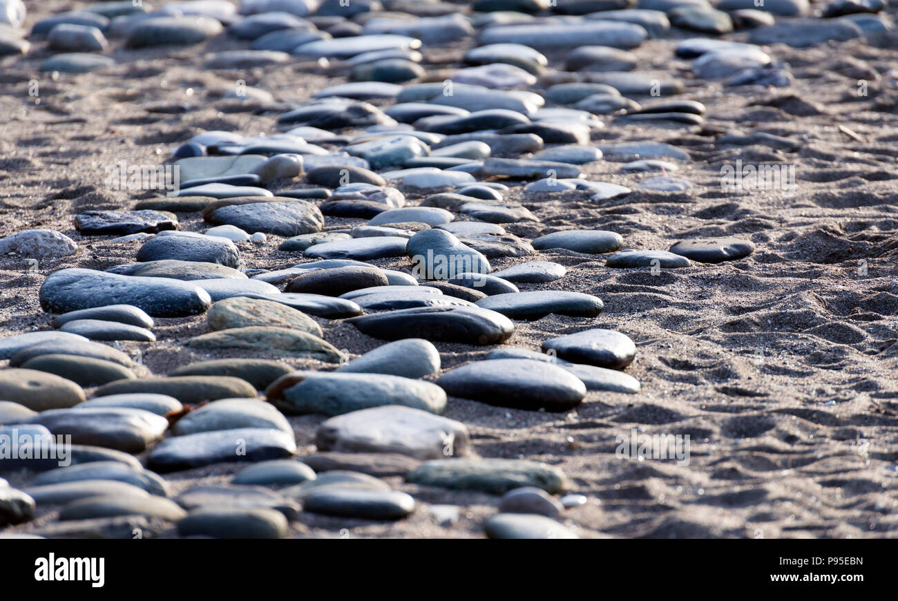 Steine wie Sand am Meer. Hintergrund des grauen Steinen. alten grauen Steinen Stockfoto