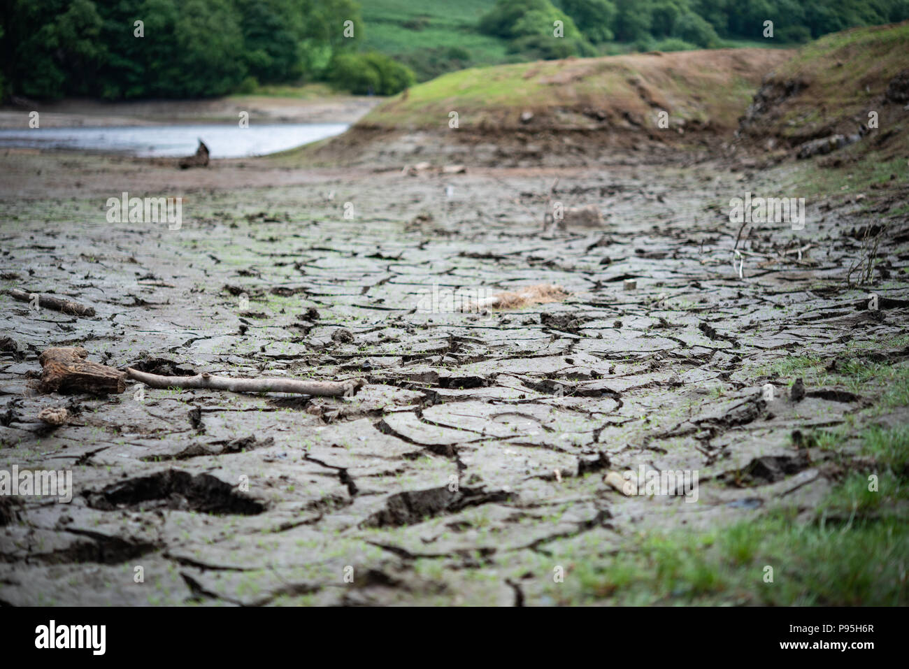 Trockenen Schmutz an der Unterseite der getrockneten Behälter Injebreck Insel Man Risse Stockfoto