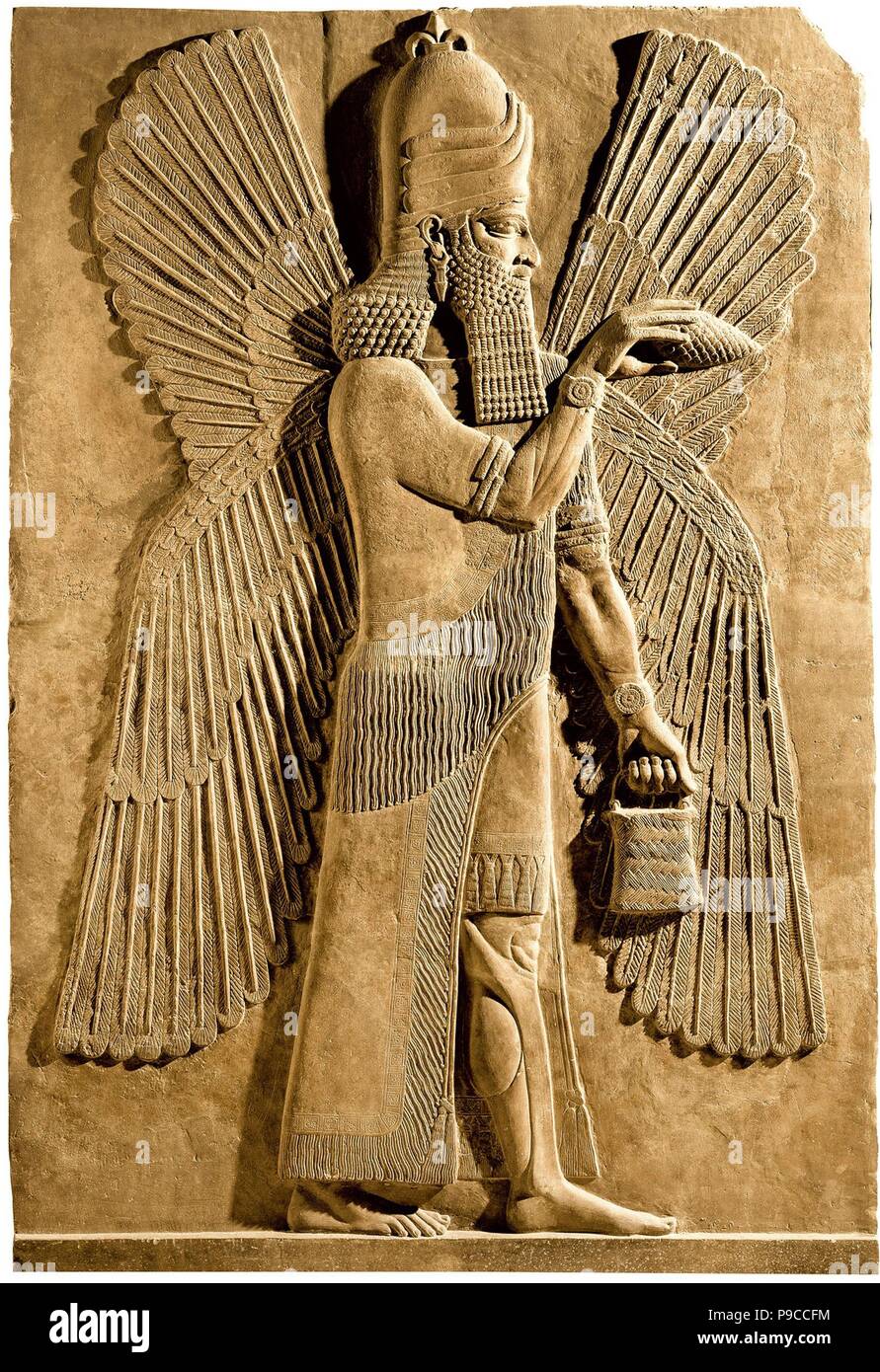 Geflügelte Genie. Detail einer Entlastung vom Palast der Assyrische König Sargon II. Museum: Musée du Louvre, Paris. Stockfoto