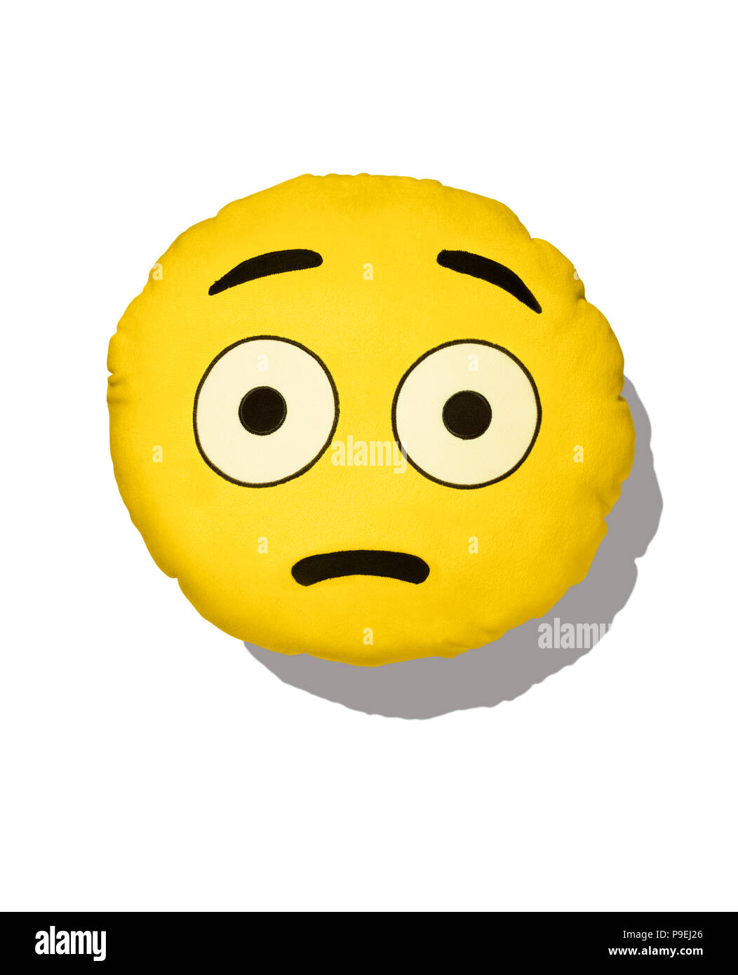 Eine bunte Schuß der erschrocken oder überrascht Emoji Kissen. Stockfoto