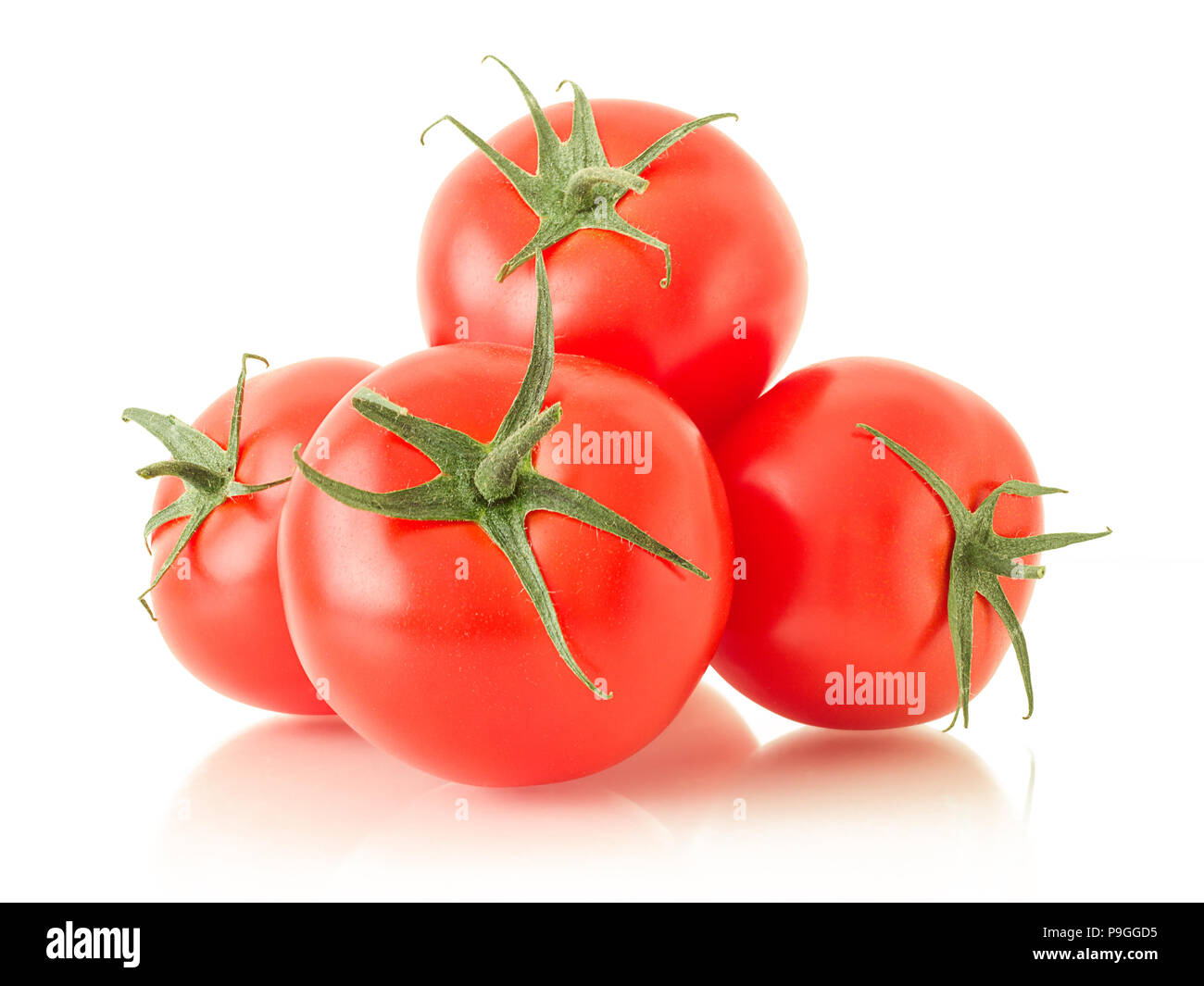 Reife Tomate mit grünen Blättern Stockfoto