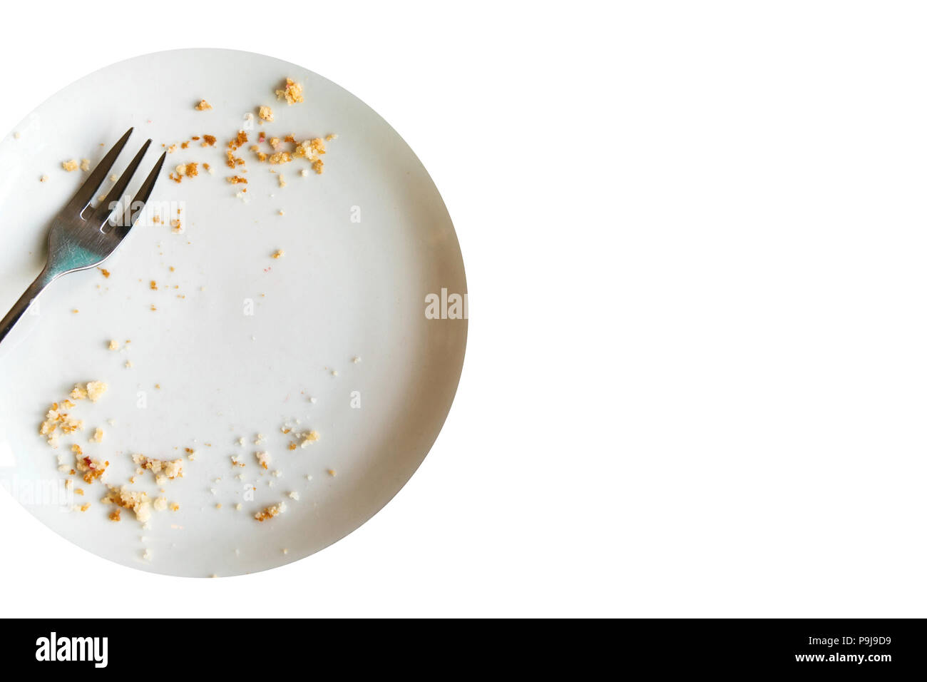 Leeren Teller mit krümel nach dem Essen auf einem weißen Hintergrund. Das Konzept des Ende des Urlaubs oder Feier. In der Nähe Platz für Text. Stockfoto