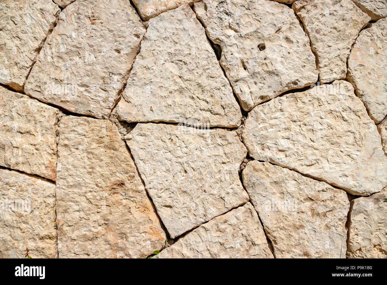 Stein Wand aus verarbeiteten Steine Stockfoto