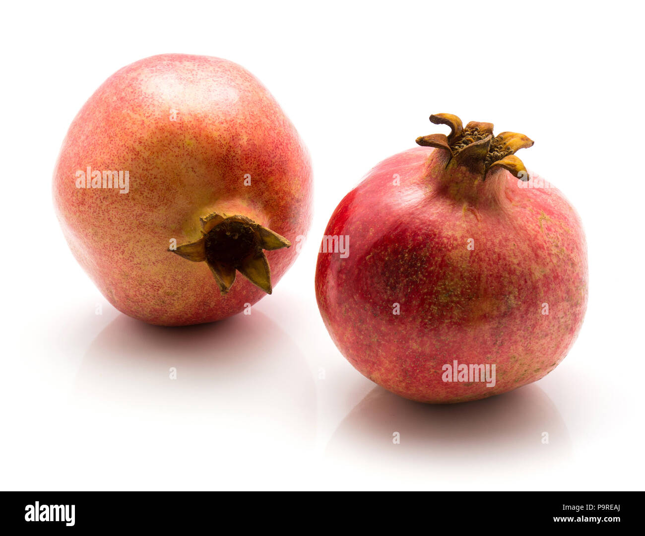 Granatapfel isoliert auf weißem Hintergrund zwei rote Stockfoto
