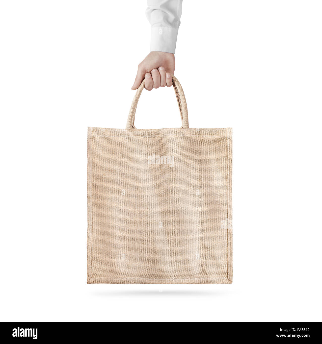 Leere Baumwolle eco Bag Design mockup isoliert, die Hand, clipping path. Textile Stoffbeutel mock up Vorlage halten Sie arm. Tote schuh Verbraucher wiederverwendbare Org Stockfoto