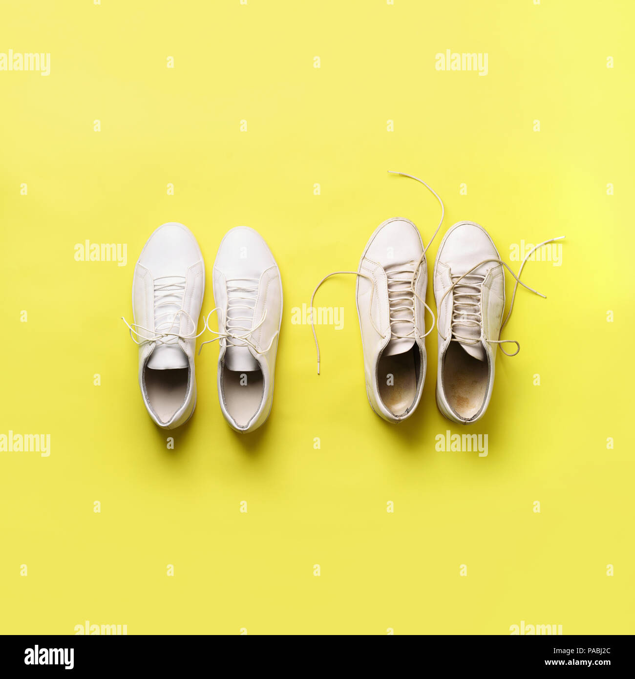 Dreckigen sneakers vs neue weiße Sneakers auf gelben Hintergrund. Trendige  Schuhe. Platz crop. Ansicht von oben. Konzept der Erfahrung, Disziplin und  Chaos, ac Stockfotografie - Alamy