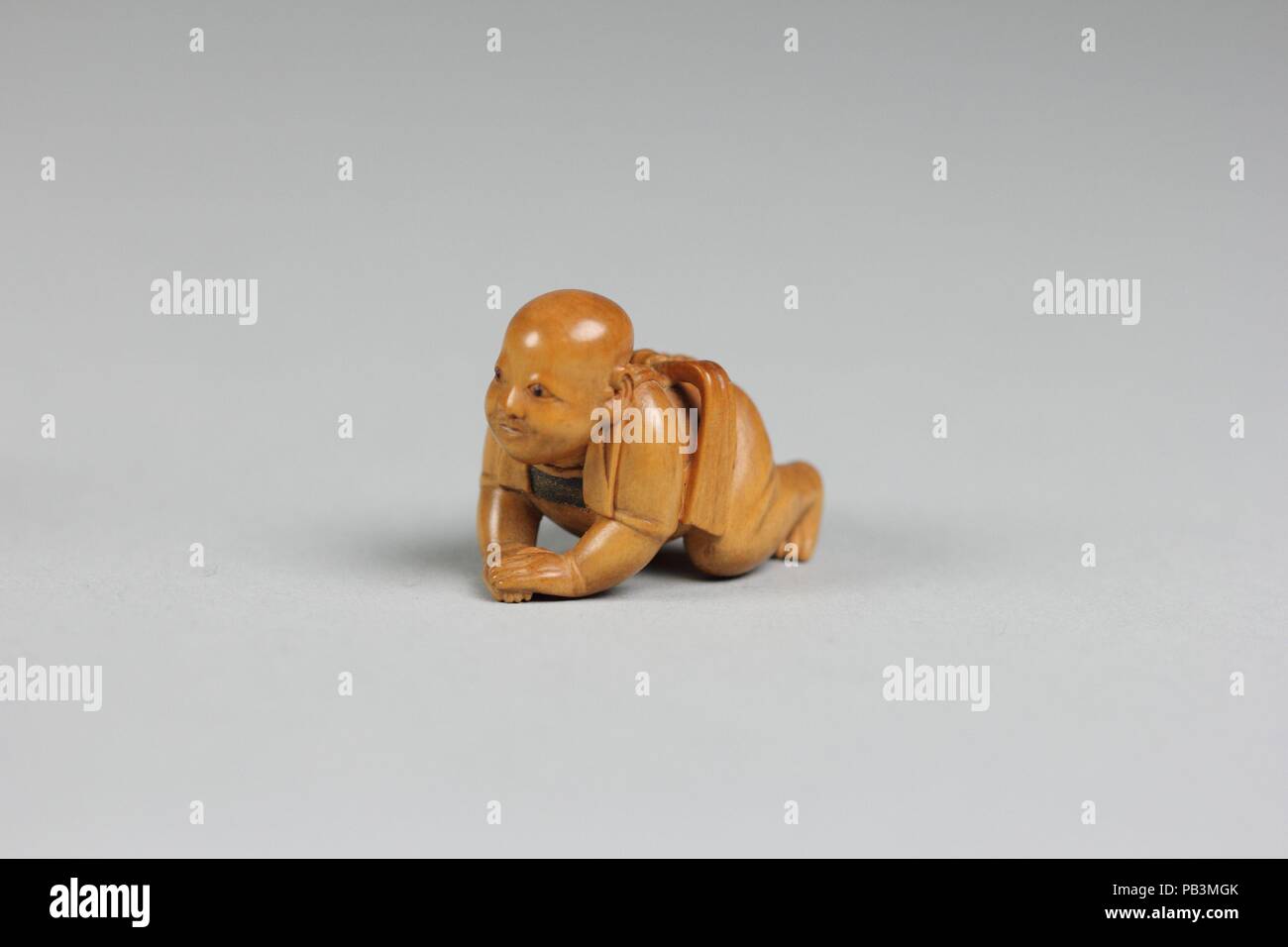 Netsuke von Crawling Kind. Kultur: Japan. Abmessungen: L 1 3/4 in. (4,4 cm). Datum: 18. Museum: Metropolitan Museum of Art, New York, USA. Stockfoto