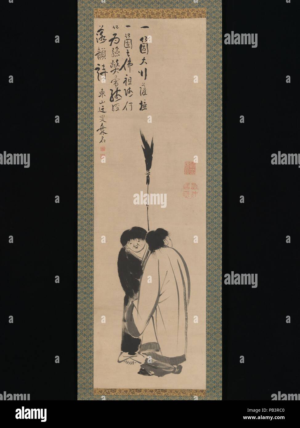 Hanshan und Shide (Japanisch: Kanzan und Jittoku). Artist: Ito Jakuchu (Japanisch, 1716-1800); Kalligraphie zurückzuführen auf Ike Taiga (Japanisch, 1723-1776). Kultur: Japan. Abmessungen: Bild: 39 1/2 x 11 15/16 in. (100,4 × 30,3 cm) Insgesamt mit Montage: 69 11/16 x 15 3/8 in. (177×39 cm) Insgesamt mit den Knöpfen: 69 11/16 x 17 5/16 in. (177×44 cm). Datum: Ende des 18. Jahrhunderts. Hanshan und Shide (aktive Ende 8./Anfang 9. Jahrhundert) wurden Chan buddhistische Mönche, die low-level-Positionen bei Guoqingsi, einem Tempel auf Chinas heiligen Berg Tiantai statt. Vom Betrachter weg hier gedreht, Hanshan ('Cold Mountain') wurde Stockfoto