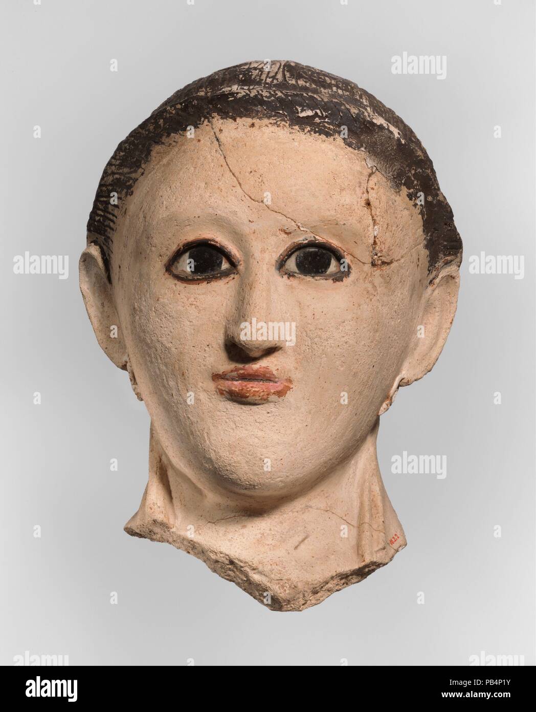 Grabkunst Maske. Abmessungen: h. 15,5 cm (6 1/8 in.); w. 9 cm (3 9/16 in.). Datum: 250-300. Museum: Metropolitan Museum of Art, New York, USA. Stockfoto