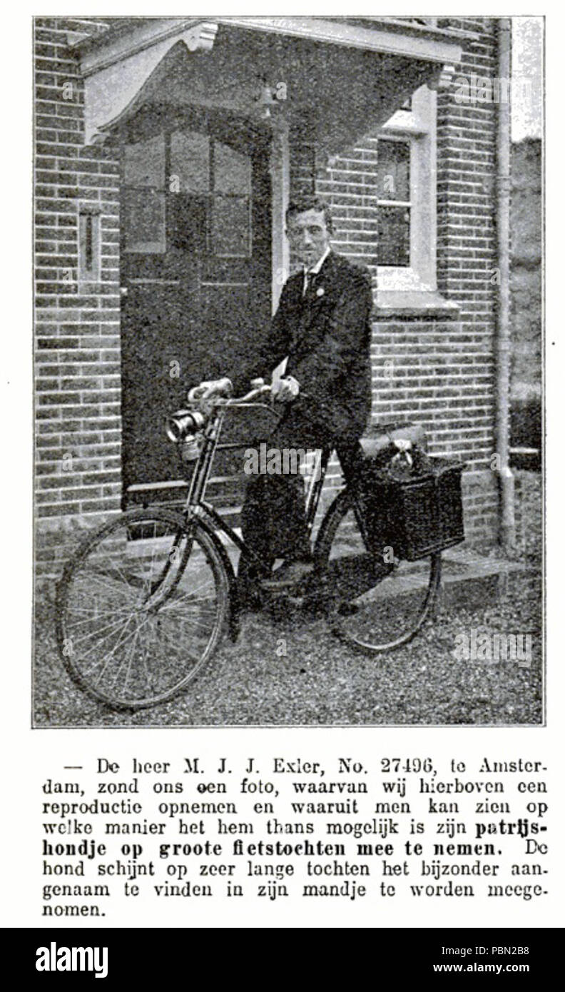 977 M.J.J. Exler auf dem Fahrrad mit Hund - De kampioen - 3. Juli 1914 Stockfoto
