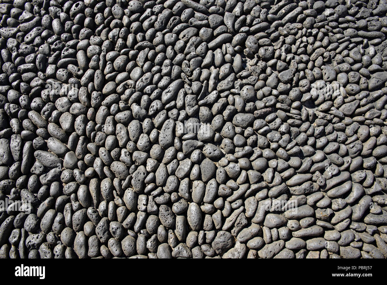 Oberfläche aus schwarzer Lava Steine, Felsen, das Hintergrundbild extrusive Stockfoto