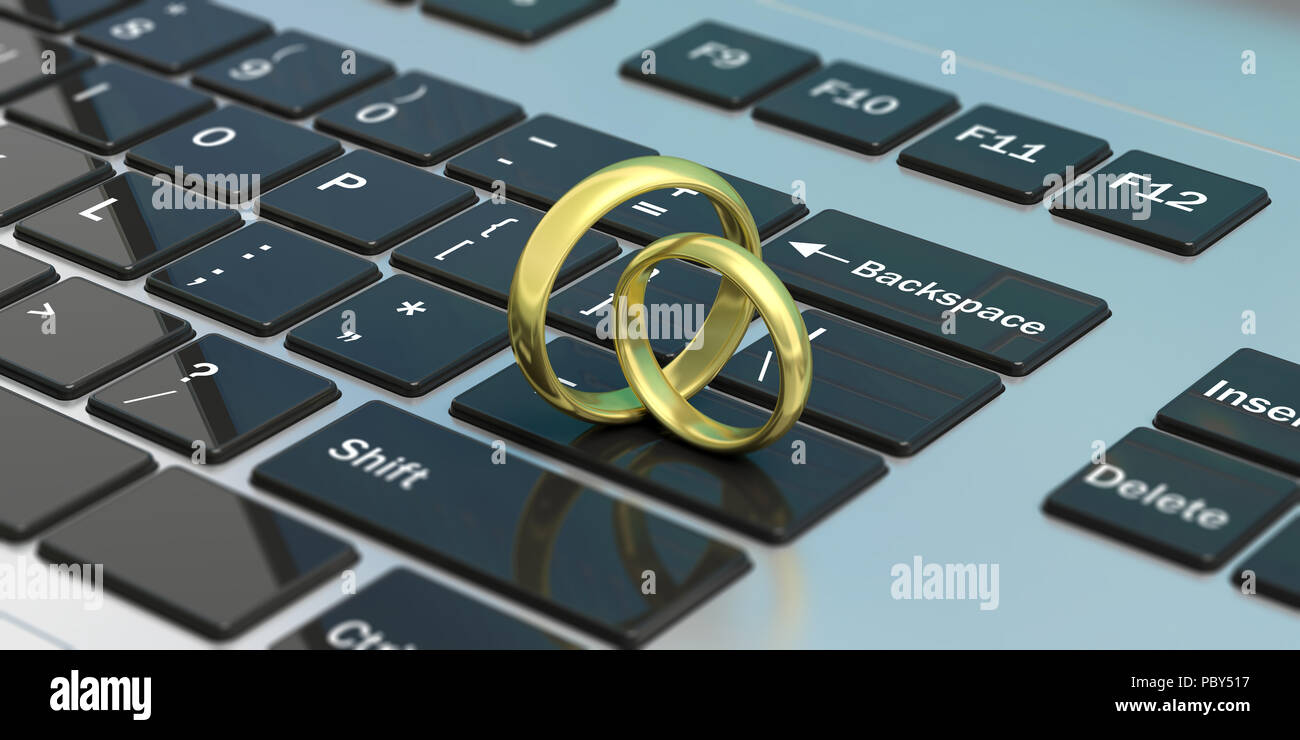 Online Dating. Paar goldene Hochzeit Ringe auf dem Computer Laptop Tastatur isoliert, 3 Abbildung d Stockfoto