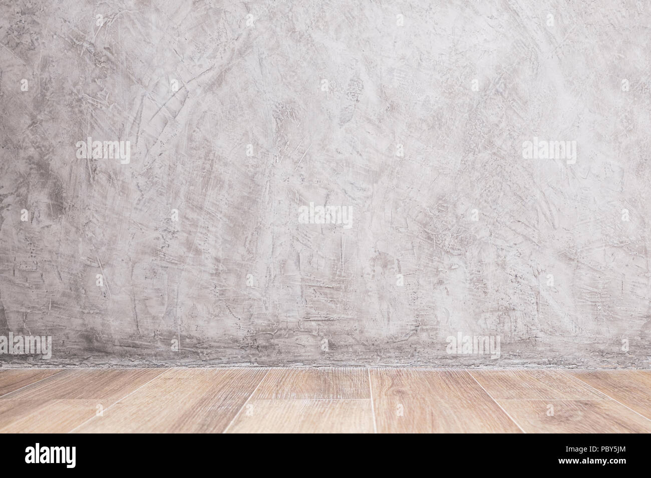 Leere Innenraum mit Farbe betonwand und Holzboden für Design. Stockfoto
