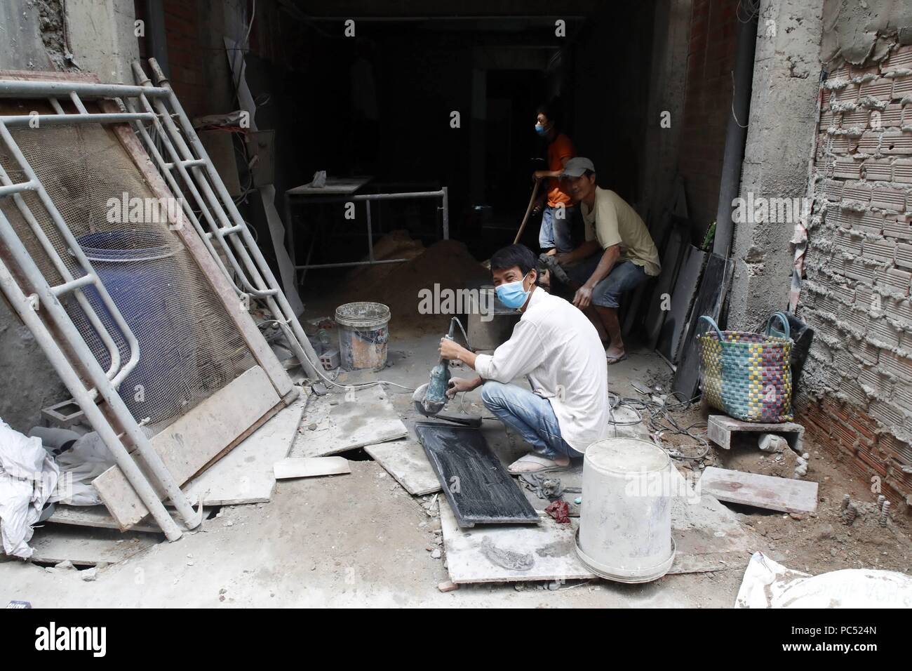 Die Arbeiter auf der Baustelle. Ho Chi Minh City. Vietnam. | Verwendung weltweit Stockfoto