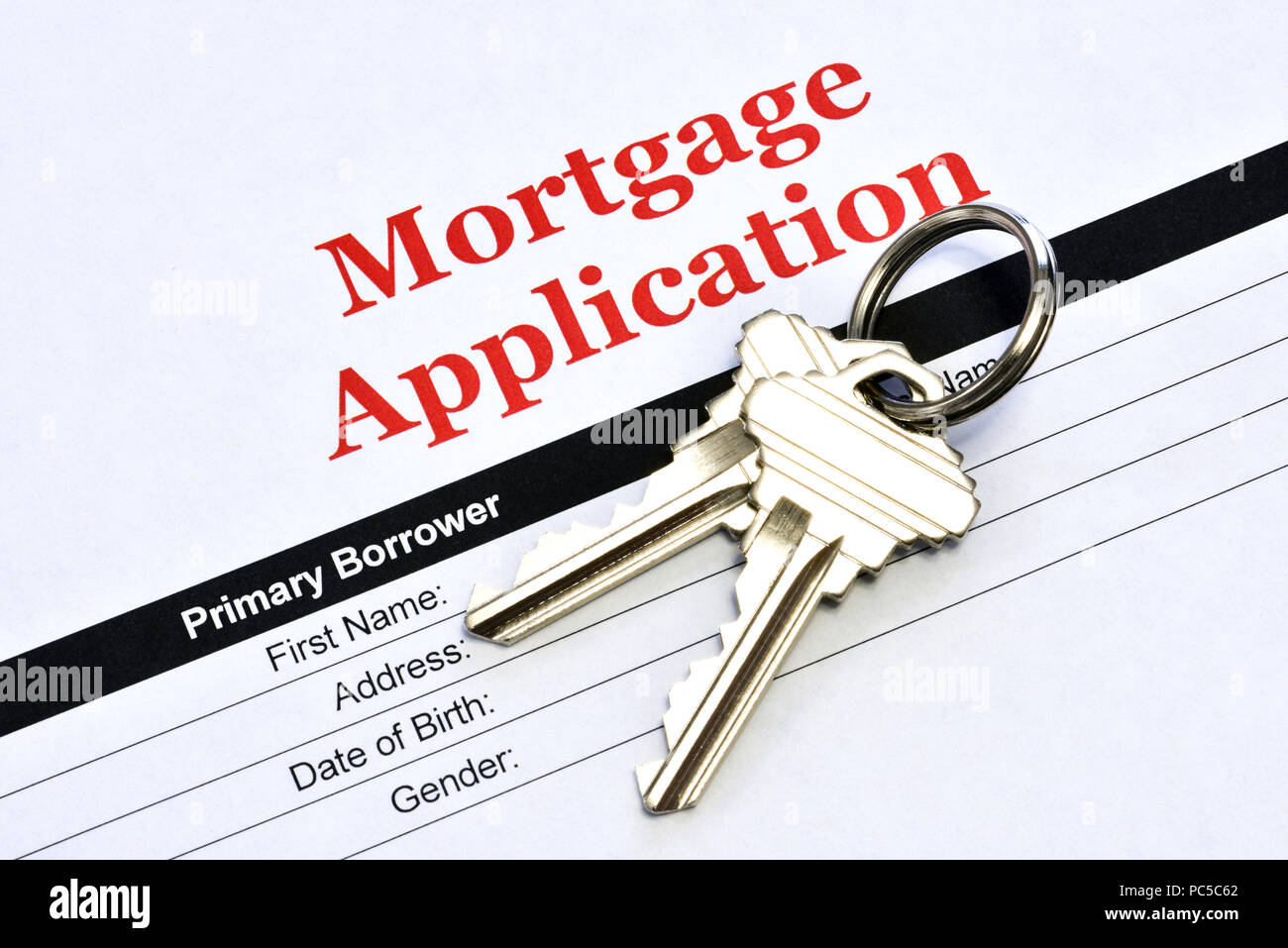 Immobilien Hypothek Anwendung Kreditvertrag mit Haus Tasten Stockfoto