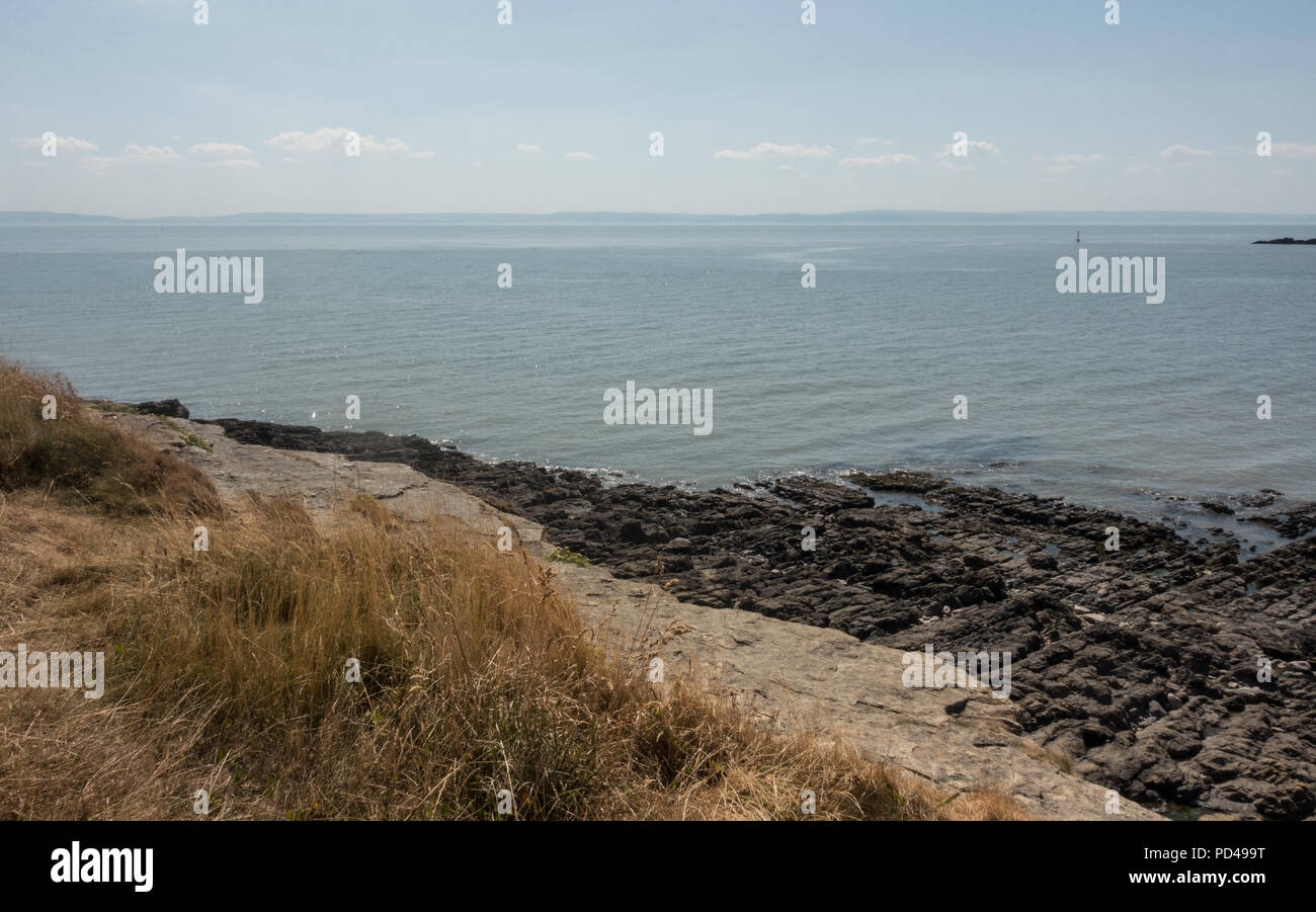 Schöne Aussicht auf die Menschen in der Sonne bei Barry Island Beach in South Wales Stockfoto
