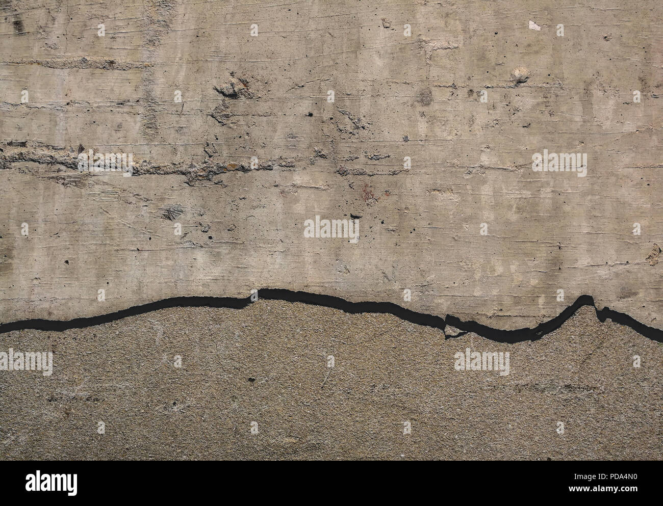 Nahaufnahme Textur von gerissenen Beton Wand Hintergrund Stockfoto