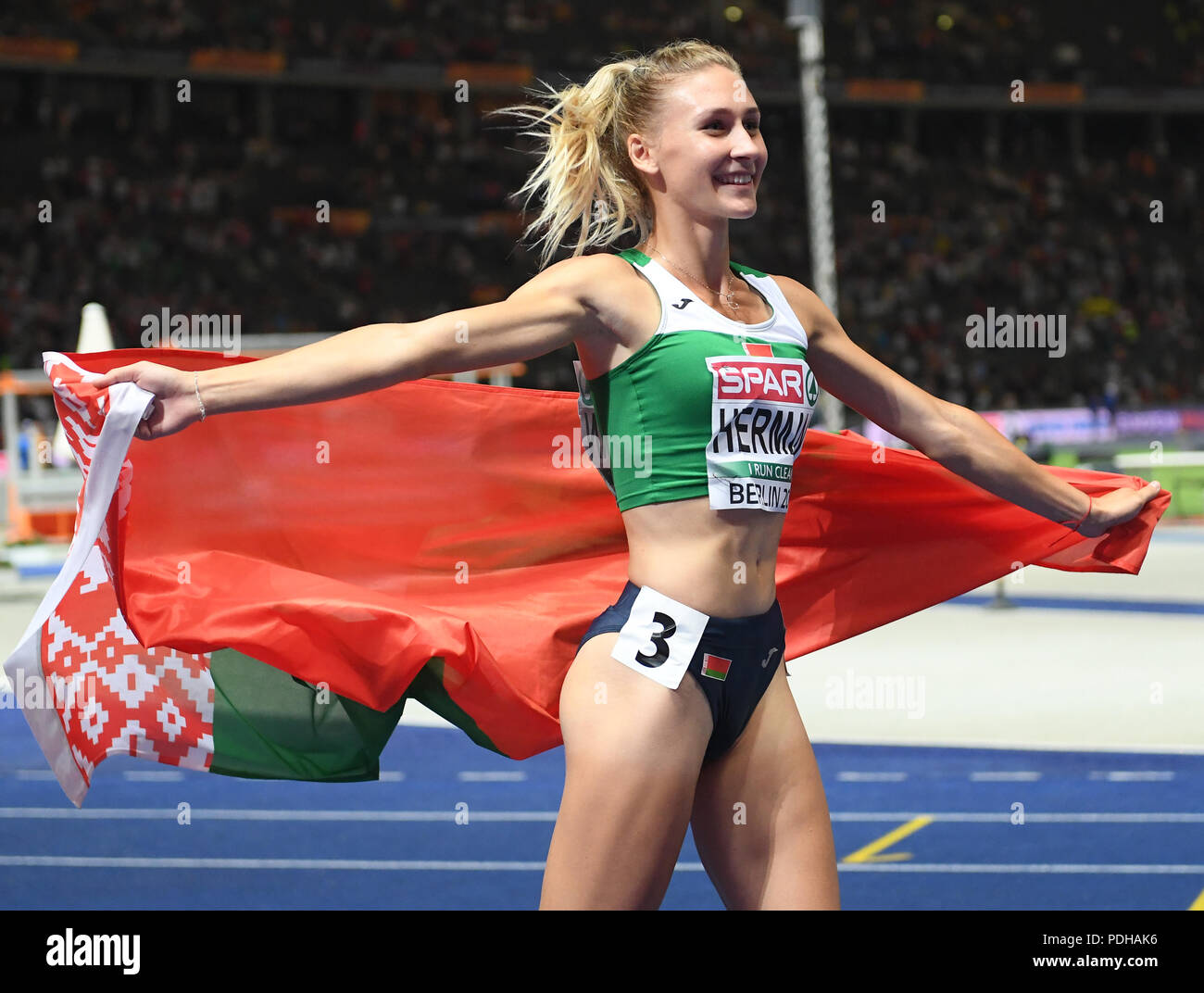 Berlin, Deutschland. 09 Aug, 2018. 09.08.2018, Berlin: Leichtathletik, europäischen Meisterschaften in der Olympischen Stadion: 100 m Hürden, Frauen, Finale: Elvira Herman aus Belarus feiert Gold. Credit: Hendrik Schmidt/dpa-Zentralbild/dpa/Alamy leben Nachrichten Stockfoto