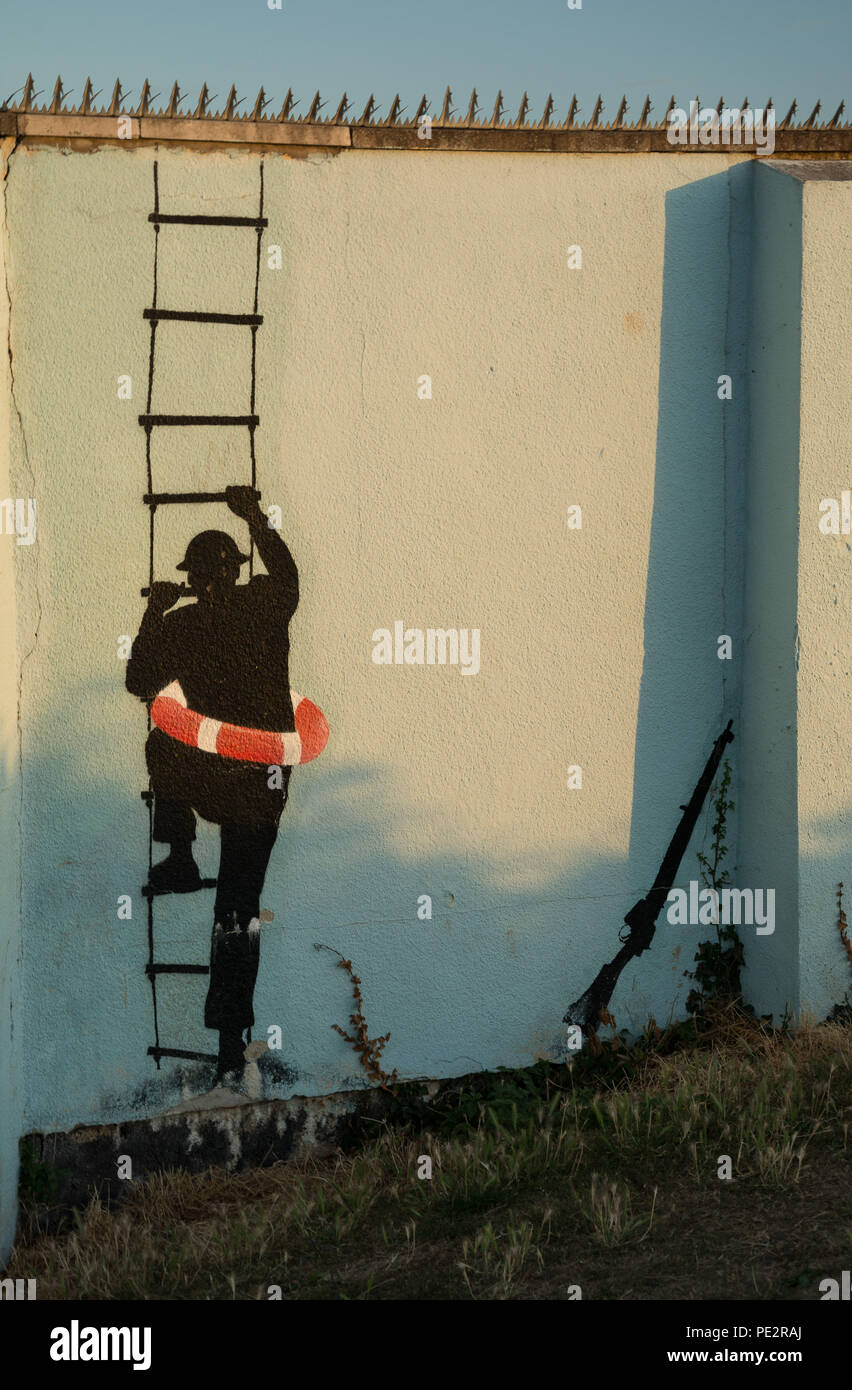 Graffiti des Menschen klettern Strickleiter, Street Art Stockfoto
