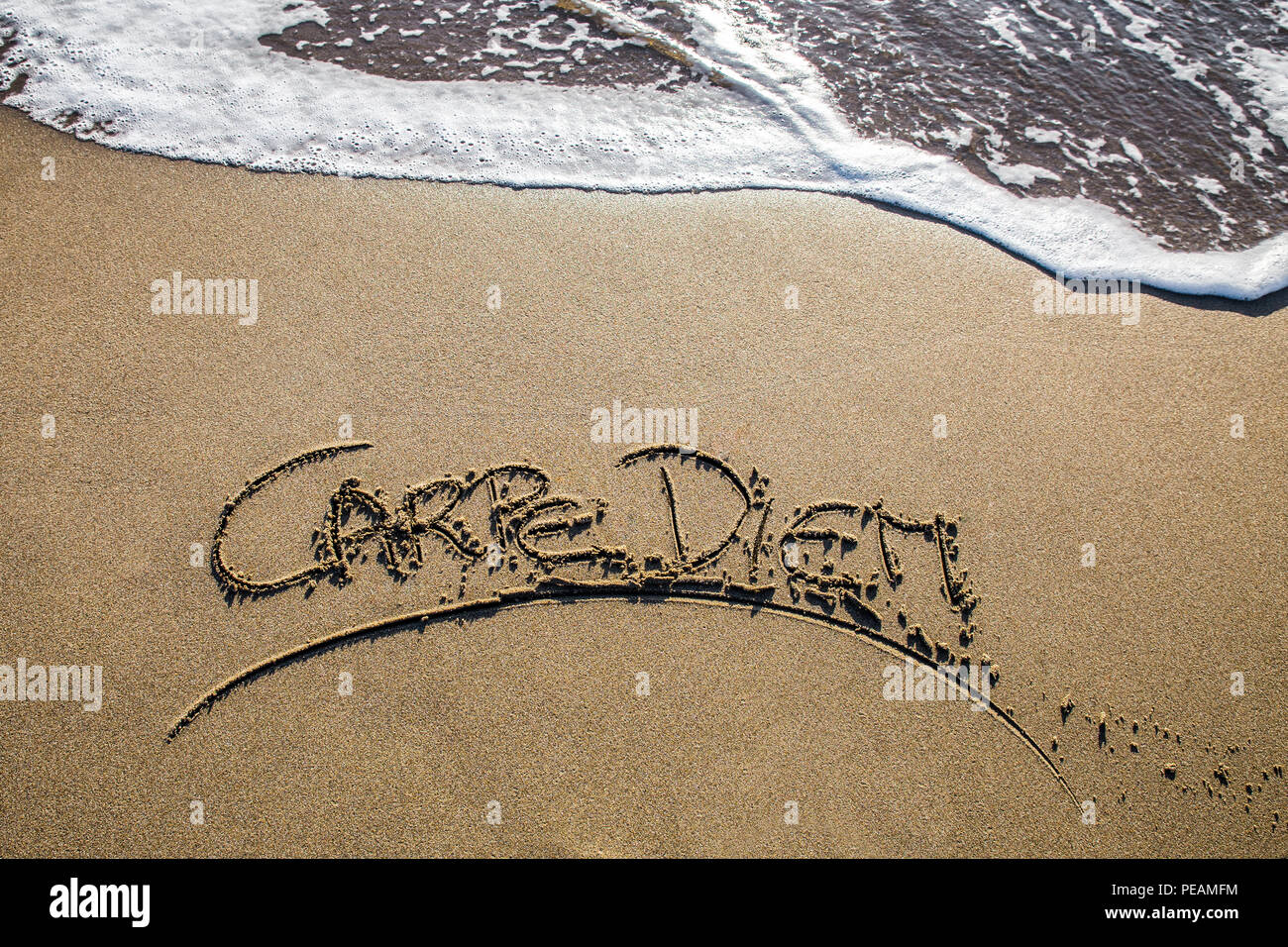 Carpe diem am Strand Stockfoto