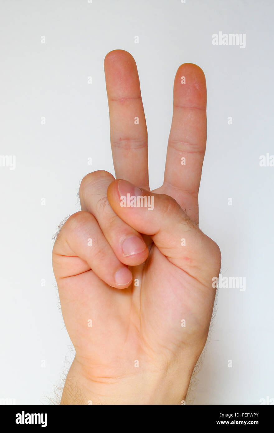 Zwei Finger. Frieden oder Sieg unterzeichnen. Des Menschen Hand mit zwei Fingern Stockfoto